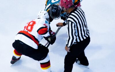 Three Men In A Hockey Muddle
